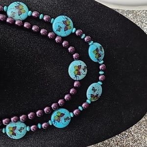 Hand crafted 22 inch double strand necklace with beads with a butterfly design
